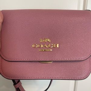 Coach mini pink crossbody purse, worn a couple times.
